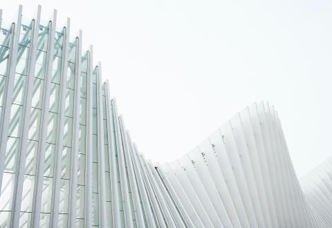 A curved building consisting of direct election beams.